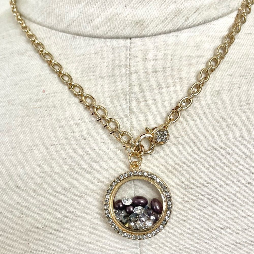 Ballet gold tone pendant necklace with faux diamonds